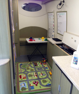 An interior view of Mobile REACH, decorated to be appealing for a young child during autism assessment